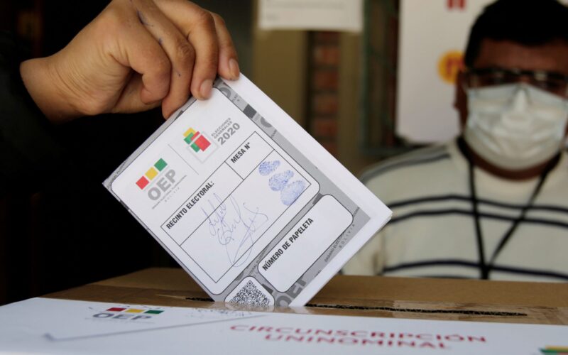 A man casts his vote during a voting simulation at a polling station in La Paz